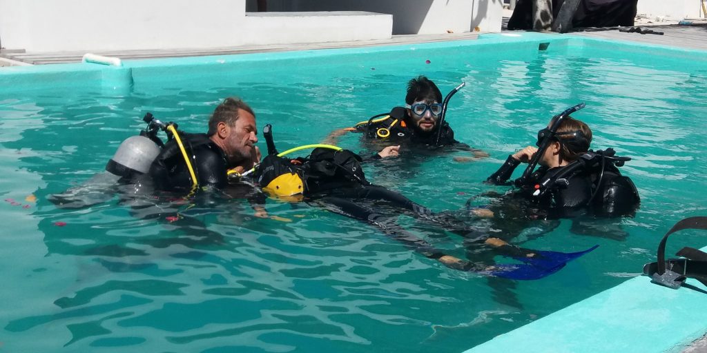 PADI pros train budding divers in a pool. 
