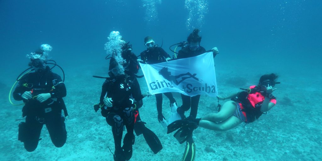 A team of women divers explore the reefs surrounding Mahe while working toward their PADI scuba qualification.