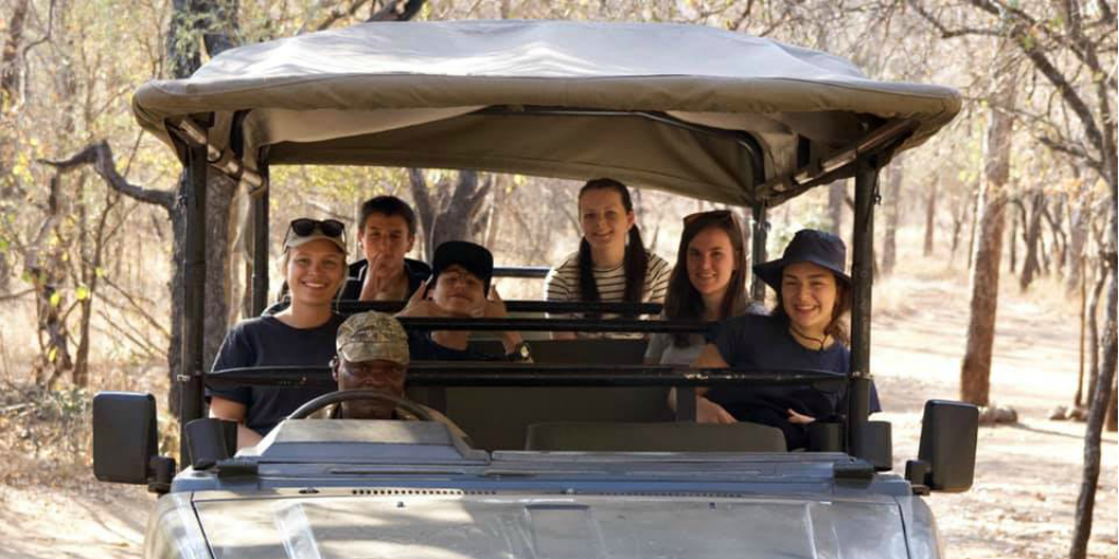 Volunteers in a safari vehicle with a game ranger in Limpopo.
