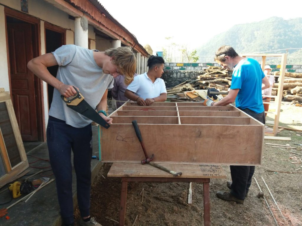 participants constructing cupboards in nepal
