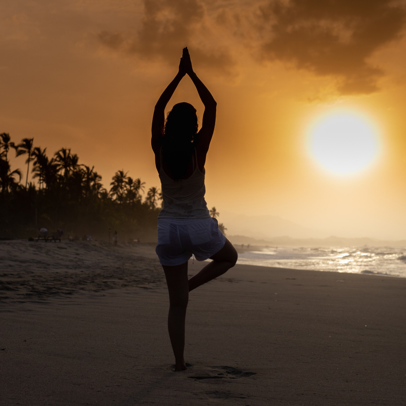 Meditate on the beach at sunrise
