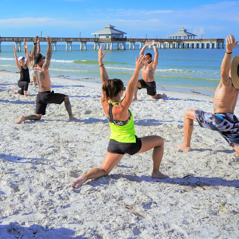 Practise sunrise yoga on a beach pier