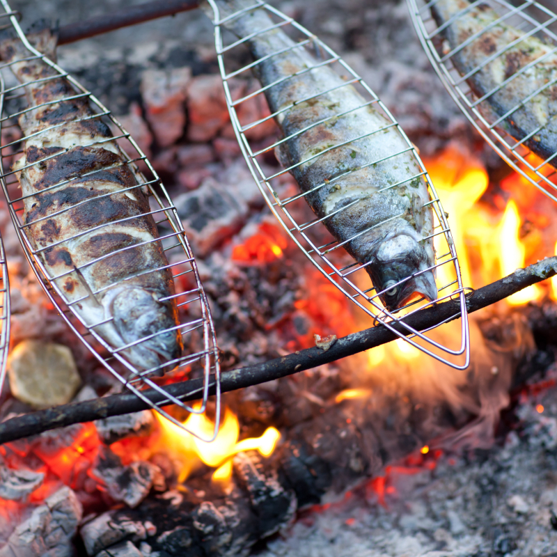 Enjoy a Belizean fish BBQ on the beach